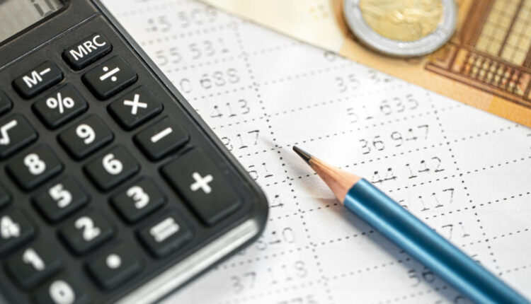 calculator-money-pencil-closeup-blurred-background (1)